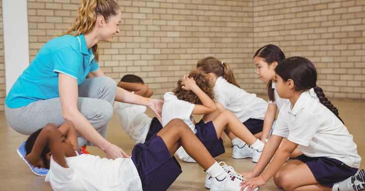 students-helping-other-exercise-elementary-school