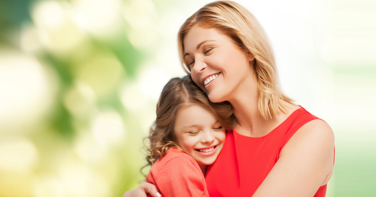 Happy Woman With Baby Girl
